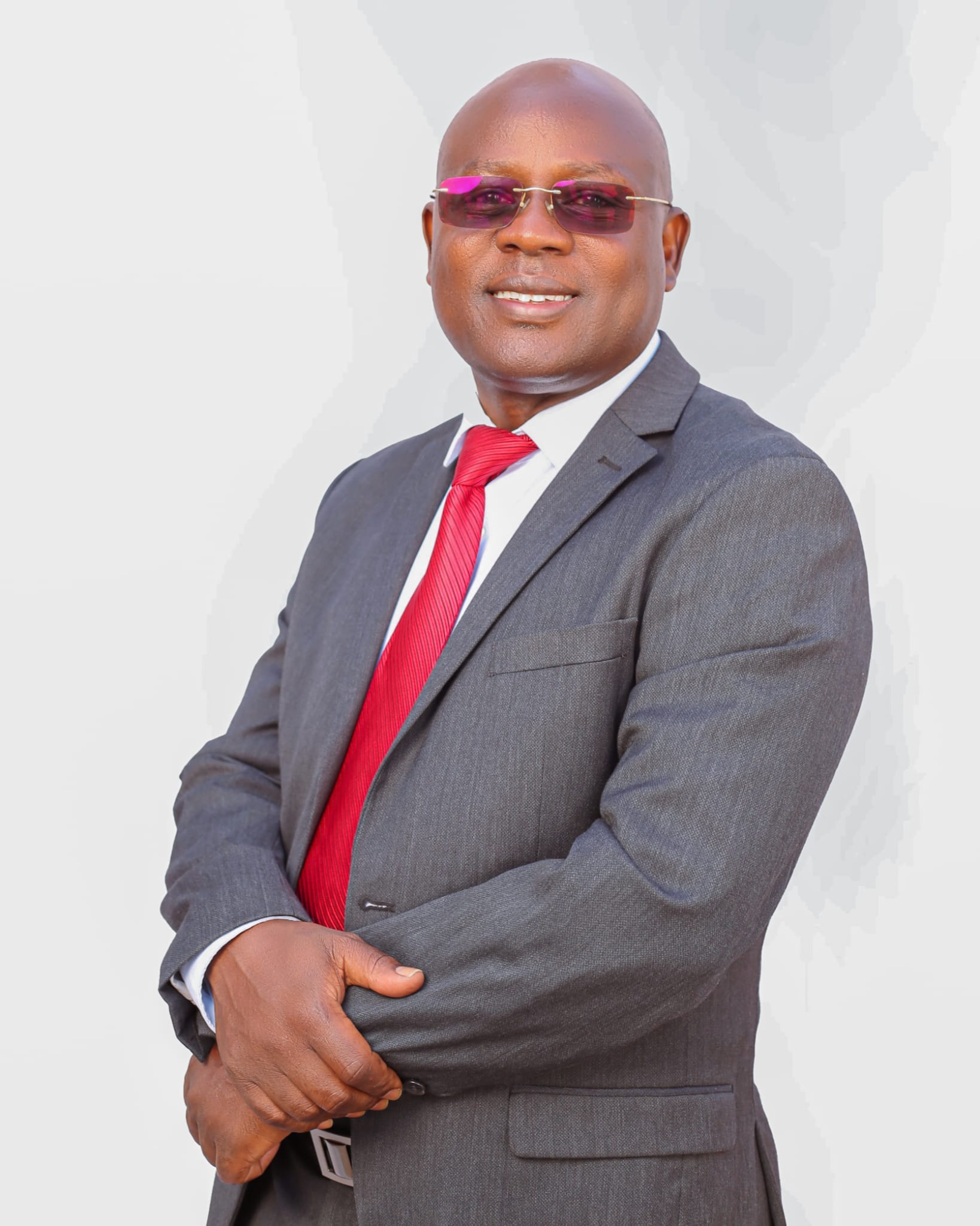 His Excellency, Dr. John Erus